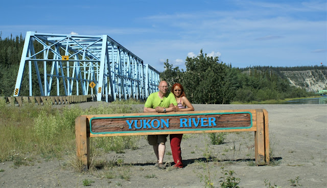 sign of Yukon River and the bridge across the river in Yukon Territory Canada