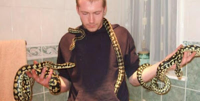 Brit snake handler dies after lethal hug from his 8ft long 'baby' python Tiny