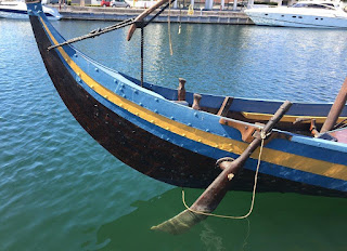 Steering oar on starboard side of ship