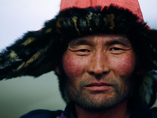 Excellent Photography image of Western Mangolian Man Wears a Fur-Trimmed Hat