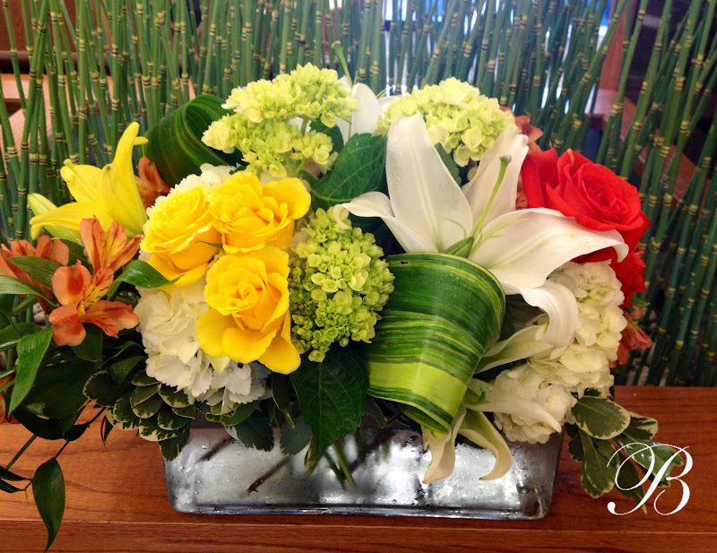 With the vibrantly bold yellows and oranges, our flowers complemented  title=