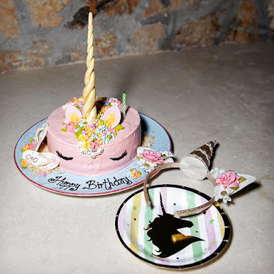 Shay Mitchell unicorn-themed birthday party with cake and  headband