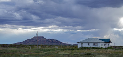 Old house with Tucumcari Mountain in the background