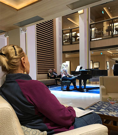 Enjoying piano by Aleksandra in the Atrium aboard the Viking Sky (Source: Palmia Observatory)