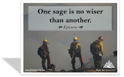 One sage is no wiser than another - Epicurus (3 firefighters atop a mountain surveying the scene)