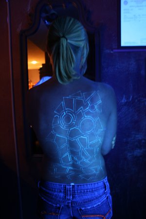Glowing UV Playboy Bunny Tattoo. A bit of white UV ink sets this Playboy
