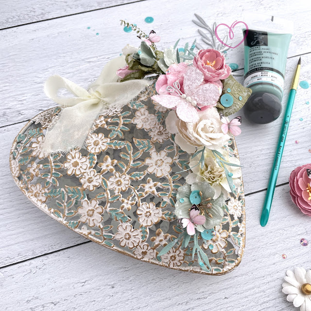 Altered shabby chic heart created with: Sizzix creamy matte acrylic pain in agave, multi-tool effectz, woodland stems die, muted cardstock, mint julep sequins mix; Prima avec amour paper flowers; Reneabouquets sweet pea butterfly kisses pink; Pinkfresh Studio jewels ballet slipper