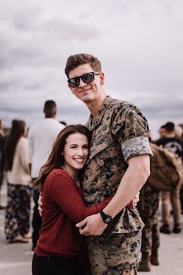 Marine and Wife reuniting at their homecoming after a long deployment at Marine Core Air Station Miramar with VMFA 225 by Morning Owl Fine Art photography San Diego.