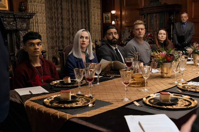 A group of people dine at a table