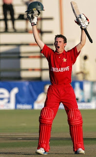 Sean Williams raises his hands in triumph after Zimbabwe defeated Pakistan for the first time in 15 years