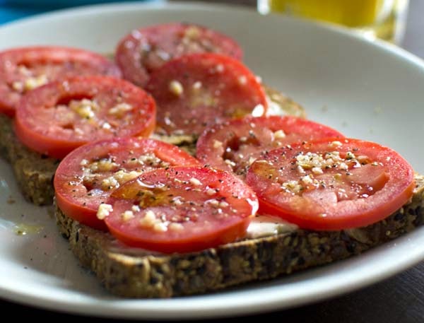 Sliced Tomatoes on Toasted Bread for Breakfast. Recipes Don't Get Any Easier Than This Healthy Idea.