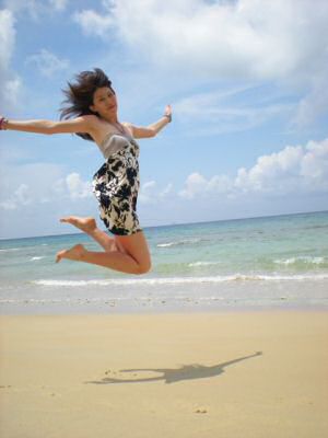 Sexy girl jumping on the beach of Tioman Island