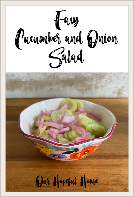cucumber and onion salad in small porcelain bowl
