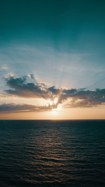 Sun Rays Over Ocean iphone Wallpaper