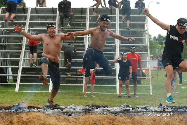 Friends crossing the Spartan Fire Jump together