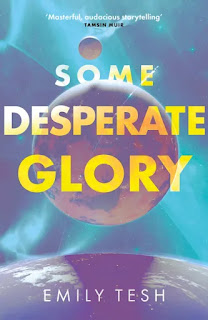 Book "Some Desperate Glory" by Emily Tesh. One planet rises over another, against a background of blue sky and stars.