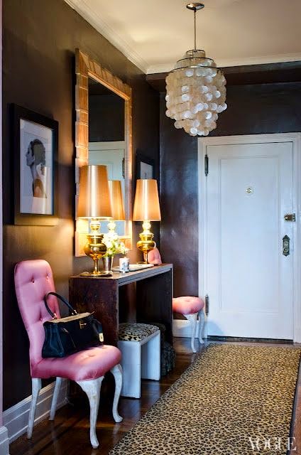 black walls in foyer with pop of hot pink and leopard