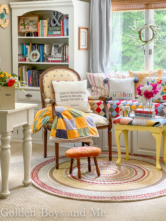 Colorful quilts in DIY window seat - www.goldenboysadme.com