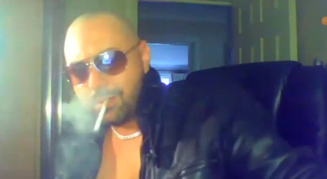 Bald Open Leather Jacket Mafia Daddy Smoking A Cigarette With Shades