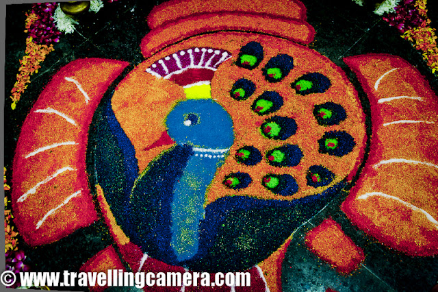 Diwali Rangoli,Art at Adobe, Rangoli is a traditional decorative folk art of India. These are decorative designs made on floors of living rooms and courtyards during Hindu festivals and are meant as sacred welcoming areas for the Hindu deities. The ancient symbols have been passed on through the ages, from each generation to the one that followed, thus keeping both the art form and the tradition alive. Rangoli and similar practices are followed in different Indian states; in Tamil Nadu, one has Kolam, Madanae in Rajasthan, Chowkpurna in Northern India, Alpana in Bengal, Aripana in Bihar, and so on. The purpose of Rangoli is decoration and it is thought to bring good luck. Teams make rangolis every year before Diwali at Adobe. However, this time the patterns were incredibly intricate and imaginative.Om is the sacred symbol of Hinduism, Buddhism, and Jainism and can often be seen in religious arts. Rangoli is no exception.The traditional rending of a new bride in a Doli. In medieval and ancient India and for a long time even in modern India, after marriage, dolis bourne on the shoulders of 4-6 men were used to transport the new bride to her husband's home. Marigold flowers (गेन्दा) are inseparable from Hindu Prayers and religios decorations. Idols of Deities are often adorned with garlands of marigold flowers and red roses.This is a clever integration of a peacock in the face of Lord Ganesh. While the peacock is the greatly revered in Hindu Scriptures, Lord Ganesh is the deity who the Hindus rely upon to take care of new entreprises. Beautiful colors and image! The peacock is also the National Bird of India.A pattern with the peacock in the center and outlined with marigold and rose petals.A Peacock is often referred to as a bird with a hundred eyes owing to the eye-like patterns in its tail feathers. The Kalash (a brass pot) is a symbol of abundance in Hinduism. It is often worshipped during the yagyas along with the deities in Arya Samaj branch of Hinduism. Full rendering of a peacock on the branch of a flowering plant with symbols of various Adobe Products in its tail. It is holding a scroll with the symbol of Adobe and the Sacred Swastik in its beak. Swastik, contrary to common knowledge, is an ancient holy symbol in Hinduism. Unfortunately, it was used by Nazis and after that the real, holy meaning seems to have been lost to the world. But in India, it is still used with a lot of respect in almost all religious ceremonies.  Lord Ganesh with his elephant head and human body. Lord Ganesh is widely worshipped along with Goddess Lakshmi (the Godess of Wealth) during diwali. Lord Ganesh, himself, is considered to be the God of New Beginnings, someone who removes hurdles. Another colorful design with the logos of various Adobe products, You can see the well know photoshop, Premiere Pro, Dreamweaver, Acrobat, InDesign etc.Diya's (earthen lamps) are used during diwali to decorate houses and businesses. They are shallow vessels made of clay or brass and have a cotton wick dipped in mustar oil.This design is more traditional with Om and a stark white color against a bright red. Two peacocks with their royal blue necks and bright green plumage. Peacocks seemed to rule the designs this year. A new age Ganesh with his vehicle, a mouse. If you look closely, the mouse if offering him an Apple that looks strikingly similar to the logo of the Software Giant of the same name. While the word Adobe has been written in a calligraphic script at the top. Cheeky!A close-up of the Kalash. This one is earthern but has been paited over with a metallic paint. Around it are typical colors of Hinduism, saffron and yellow. A close-up of the calligraphic Adobe.  Baby Ganesh, floating on a cloud, over a colorful carpet of Adobe Products. Whether this cloud is a spiritual cloud or the technical cloud, is open to interpretations. Another colorful and elaborate design with Ganesh and Swastik, The shape of a mango is another common shape in Indian arts. You'll find it used in abundance in mehndis (henna tattoos) and rangolis.Photoshop, flash, Dreamweaver, Bridge and other Adobe products around an Adobe symbol. A fancy earthen Diya full of blue rangoli color.Lord Ganesh, in his various forms, has inspired many artists. And as a result, his form has been used extensively in all kinds of arts, starting from Rangoli to paintings to sculpting. Simple, yet pretty.Adobe employees admiring one of the rangolis. Elephant, another symbol of Hinduism. This one's a tusker and is carrying Adobe on its back. Elephants are closely related to Lord Ganesh. The Rangolis are as colorful as Adobe itself. This particular Rangoli is of a dancing Lord Ganesh.Happy Diwali,  Rangoli, Art,  hinduism, Ganesh, Om, Religion, Art, Colorful