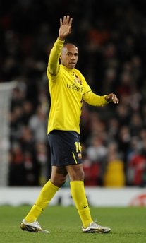 Barcelona forward Thierry Henry waves to the Arsenal fans at the end of a Champions League match