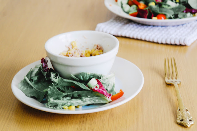 tuna and sweetcorn in bowl with a side salad