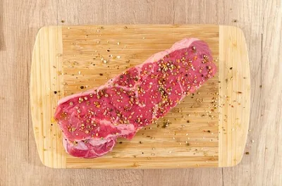 Cutting board with raw meat