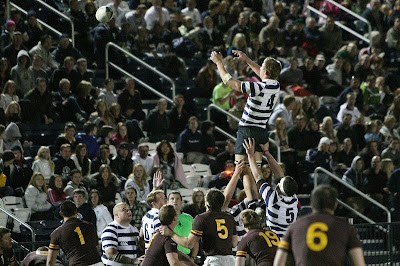 Lock Kyle Sumsion jumps high for the line-out as the packed house of BYU Rugby fans looks on