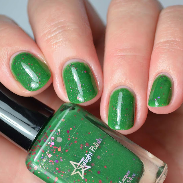 green nail polish with glitter swatch