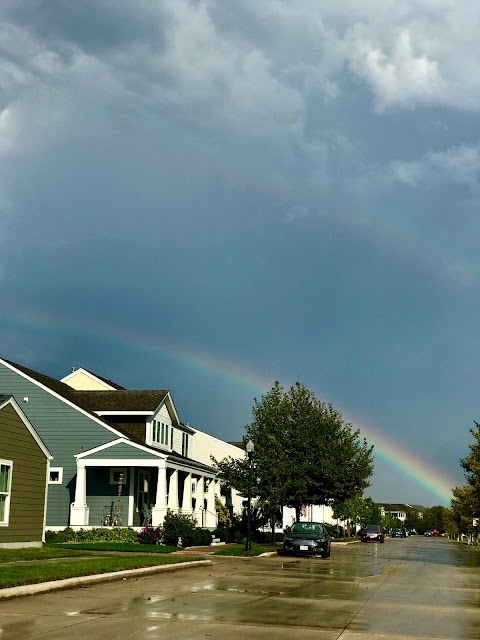 Rainbow over a house at New Town at Saint Charles