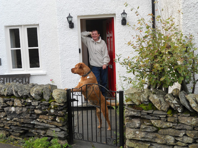 Me looking over the wall & Dad standing in the doorway.