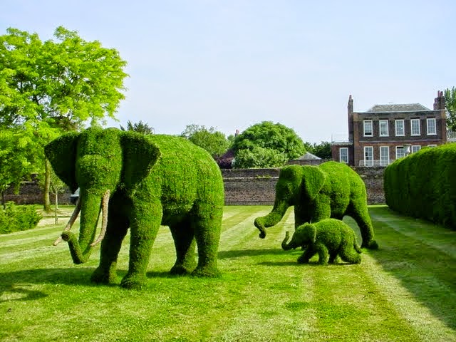 elephant sculpture in garden trimmed with brush cutter