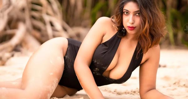 Neelam Singha black swimsuit curvy model cleavage sexy legs