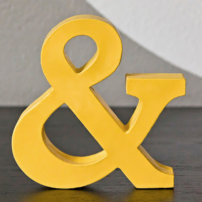 cardstock ampersand, made by layering cardstock cut with Cricut