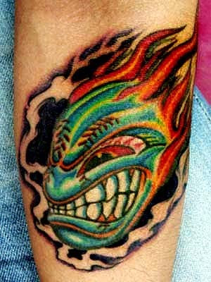 flame tattoo on inner forearm