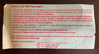 An image of a vintage TWA boarding pass