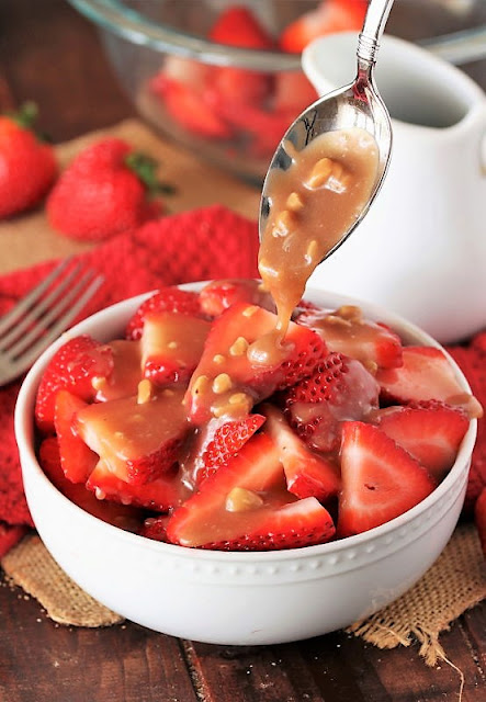 Drizzling Toffee Sauce Over Fresh Strawberries Image