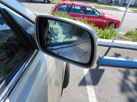 Cracked mirror on Toyota Camry before replacement at Almost Everything Auto Body