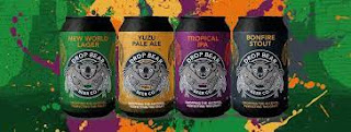 A line of four Drop Bear Beer cans