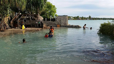 Finished seawall, Destroyed Homes and Homeless People in Kiribati