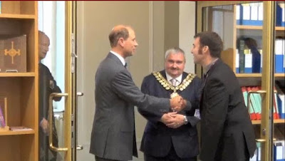 The Earl of Wessex being greeted by Paul Stebbing at the door to the Archives watched by the Mayor
