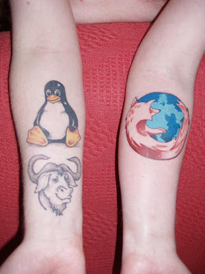 firefox and linux tattoo on hands
