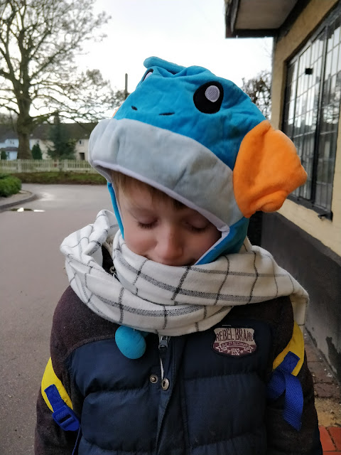 child with aspergers wearing pokemon hat and Fairy Tail Natsu scarf