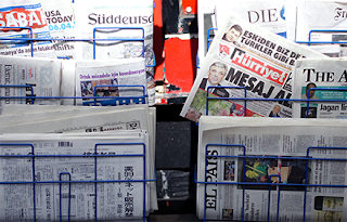 Newspaper stand with newspapers in various languages