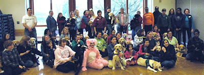 group of children with raisers and their pups