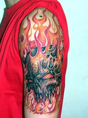 Red skull tattoo on arm picture While the skull has been tattooed on the