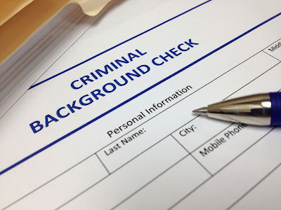 Cropped photo of a criminal background check form