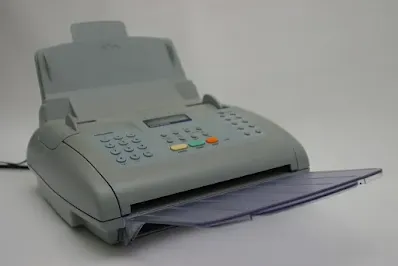 A photo of a modern fax machine