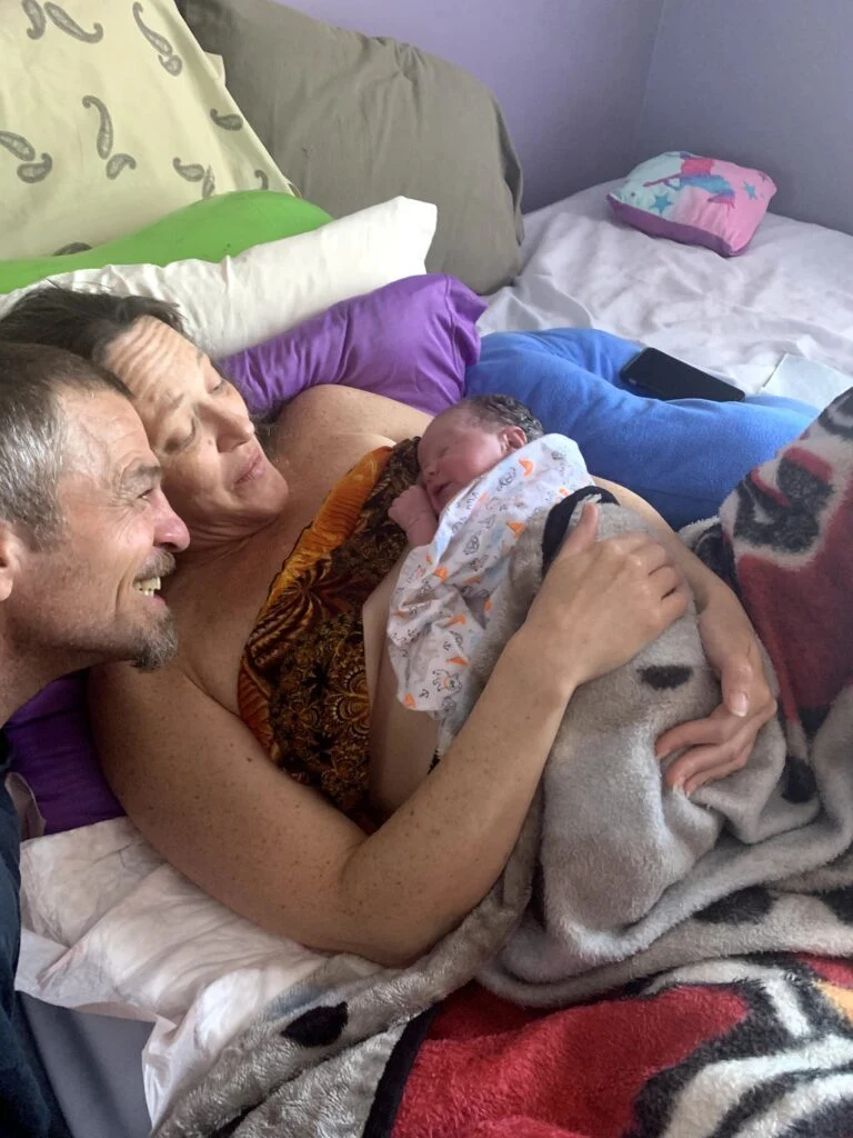 Happy mom and dad with their newborn baby.