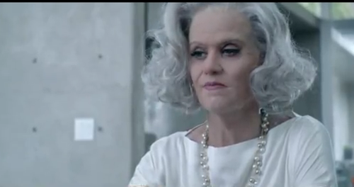 In this video Katy Perry puts on a wig and oldlady makeup as she reflects 